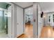 Hallway view of bathroom, bedroom, and Gathering room with hardwood floors at 355 Hartford Ave, Daytona Beach, FL 32118