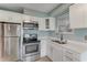 Modern kitchen featuring stainless steel appliances and white countertops at 355 Hartford Ave, Daytona Beach, FL 32118