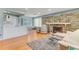 Bright, open living room with fireplace, hardwood floors and a dining area at 355 Hartford Ave, Daytona Beach, FL 32118