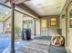 Back patio with grill, leading to the house door and windows, offering a relaxed outdoor living space at 4073 N Chinook Ln, Ormond Beach, FL 32174