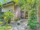 Landscaped courtyard featuring decorative rocks and lush greenery, offering a tranquil outdoor space at 4073 N Chinook Ln, Ormond Beach, FL 32174