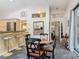 Bright dining area features backyard access and convenient access to breakfast bar and kitchen at 4073 N Chinook Ln, Ormond Beach, FL 32174