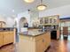 Spacious kitchen with center island, granite counters, and stainless steel appliances at 4073 N Chinook Ln, Ormond Beach, FL 32174