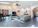 Open concept living room with vaulted ceilings, modern decor, and tile floors at 4073 N Chinook Ln, Ormond Beach, FL 32174