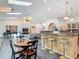 Open living room with piano, breakfast bar, dining area, and modern decor at 4073 N Chinook Ln, Ormond Beach, FL 32174