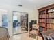 Home office with large bookshelves, desk area, and tiled floors at 4073 N Chinook Ln, Ormond Beach, FL 32174