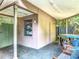 Outdoor patio with storage shed, patio furniture, and lush landscaping, perfect for relaxation and outdoor living at 4073 N Chinook Ln, Ormond Beach, FL 32174