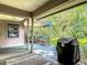 Outdoor patio with storage shed, grill, and lush landscaping, perfect for relaxation and outdoor cooking at 4073 N Chinook Ln, Ormond Beach, FL 32174