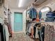 Well-organized walk-in closet with ample storage, shelving, and hanging space for clothes and accessories at 4073 N Chinook Ln, Ormond Beach, FL 32174