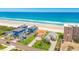 Aerial view of beachfront houses with easy beach access and nearby road at 4427 S Atlantic Ave, Port Orange, FL 32127