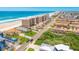 Overhead view of beachfront properties, sandy beach, and oceanfront buildings at 4427 S Atlantic Ave, Port Orange, FL 32127