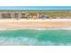 Stunning aerial view of a beachfront home with turquoise waters and sandy beach at 4427 S Atlantic Ave, Port Orange, FL 32127