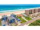 Aerial shot of beach community showcasing beachfront homes, condos, and a sandy shoreline at 4427 S Atlantic Ave, Port Orange, FL 32127