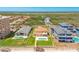 Stunning aerial view of a beachfront property with a private pool and lush green lawn at 4427 S Atlantic Ave, Port Orange, FL 32127
