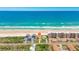 Aerial view of a beachfront property with direct beach access, situated among beautifully manicured lawns at 4427 S Atlantic Ave, Port Orange, FL 32127