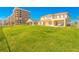 Well-maintained home with a lush lawn, balcony, and direct access to green space with an ocean view at 4427 S Atlantic Ave, Port Orange, FL 32127
