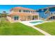 Gorgeous home with a pool and a pathway leading to the sandy beach at 4427 S Atlantic Ave, Port Orange, FL 32127