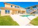 Backyard features a pool, patio and lawn, perfect for outdoor entertaining and enjoying the coastal atmosphere at 4427 S Atlantic Ave, Port Orange, FL 32127