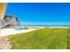Expansive backyard with a pool overlooking the ocean and beach access at 4427 S Atlantic Ave, Port Orange, FL 32127