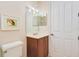 This bathroom includes a stylish vanity, toilet, mirror, and ample space at 4427 S Atlantic Ave, Port Orange, FL 32127