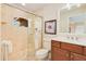 Modern bathroom with a glass-enclosed shower and a vanity with ample storage at 4427 S Atlantic Ave, Port Orange, FL 32127