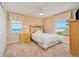 Bright bedroom with ocean view, featuring neutral decor and a comfortable bed at 4427 S Atlantic Ave, Port Orange, FL 32127