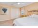 Bedroom with carpet and ocean view, featuring neutral decor and a comfortable bed at 4427 S Atlantic Ave, Port Orange, FL 32127