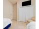 Well-lit room boasts a large closet, chair, and ample space, perfect for versatile living at 4427 S Atlantic Ave, Port Orange, FL 32127