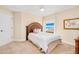 Neutral bedroom featuring a bed and a window with partial ocean views at 4427 S Atlantic Ave, Port Orange, FL 32127