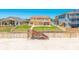 Charming two-story home featuring a beautiful lawn, beach access, and a spacious backyard at 4427 S Atlantic Ave, Port Orange, FL 32127