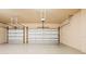 Large garage featuring two-car capacity with garage door openers and neutral walls at 4427 S Atlantic Ave, Port Orange, FL 32127