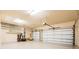 Spacious three car garage with overhead lighting, shelving and plenty of storage space at 4427 S Atlantic Ave, Port Orange, FL 32127