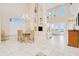 Open-concept floor plan features the dining and living areas with views of the outdoor living space at 4427 S Atlantic Ave, Port Orange, FL 32127