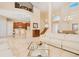 Open-concept living room with access to kitchen, dining area, and views of the outdoor living space at 4427 S Atlantic Ave, Port Orange, FL 32127