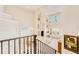 Spacious living room with soaring ceilings, fireplace, balcony view, and access to the backyard at 4427 S Atlantic Ave, Port Orange, FL 32127
