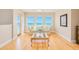 Bright living room featuring a sofa and large windows with ocean views at 4427 S Atlantic Ave, Port Orange, FL 32127
