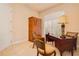 A home office with a writing desk, furnishings, neutral walls, and neutral-colored flooring at 4427 S Atlantic Ave, Port Orange, FL 32127
