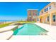 Lovely pool with ocean backdrop and ample patio space for outdoor enjoyment at 4427 S Atlantic Ave, Port Orange, FL 32127
