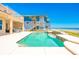 Scenic pool area with ocean views, spacious patio, and access to the sandy beach at 4427 S Atlantic Ave, Port Orange, FL 32127