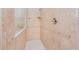 Close-up of a walk-in shower with decorative tile and a glass enclosure at 4427 S Atlantic Ave, Port Orange, FL 32127