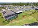 Discover the community's appeal with its screened pools and manicured landscapes, all in an aerial view at 460 Sarah Nicole Way, New Smyrna Beach, FL 32168