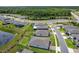 Get a birds-eye view of this neighborhood, showcasing the ponds, sidewalks, and manicured lawns at 460 Sarah Nicole Way, New Smyrna Beach, FL 32168