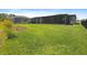 Spacious backyard with a large screened in patio, perfect for outdoor living and entertaining at 460 Sarah Nicole Way, New Smyrna Beach, FL 32168