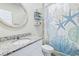 Charming bathroom featuring a vanity with granite countertops and nautical-themed decor at 460 Sarah Nicole Way, New Smyrna Beach, FL 32168