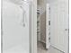 Stylish bathroom with a sleek glass-enclosed shower and convenient built-in shelving for storage at 460 Sarah Nicole Way, New Smyrna Beach, FL 32168