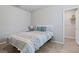 Cozy bedroom featuring a full-sized bed, and great light from the open doorway at 460 Sarah Nicole Way, New Smyrna Beach, FL 32168