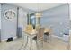 Bright dining area with tile floors, stylish lighting, and access to the patio at 460 Sarah Nicole Way, New Smyrna Beach, FL 32168