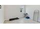 Compact exercise room with a treadmill, dumbbells, and mirror, perfect for a home workout at 460 Sarah Nicole Way, New Smyrna Beach, FL 32168