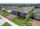 Well-kept home featuring a paver driveway, lush lawn, and mature landscaping, offering a welcoming exterior at 460 Sarah Nicole Way, New Smyrna Beach, FL 32168