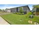 Single Gathering home with a well manicured lawn and garden beds full of colorful plants at 460 Sarah Nicole Way, New Smyrna Beach, FL 32168